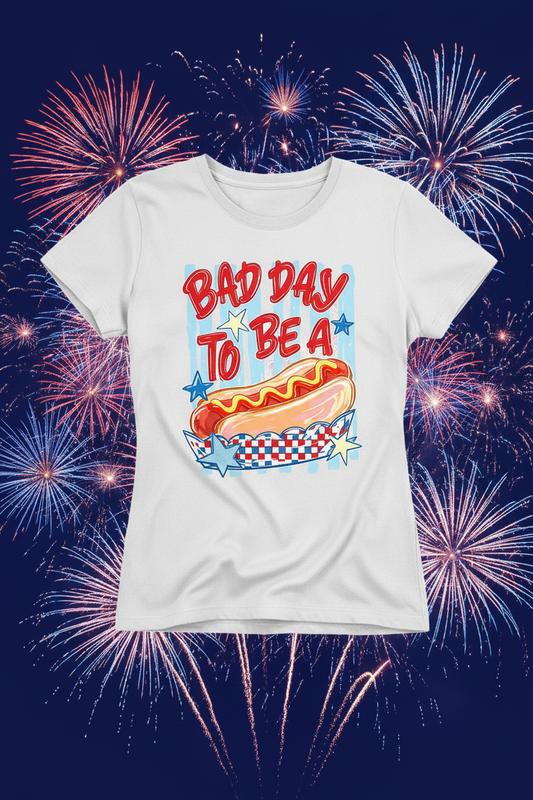 Bad Day to Be a Hot Dog white t-shirt mockup on 4th of July fireworks background