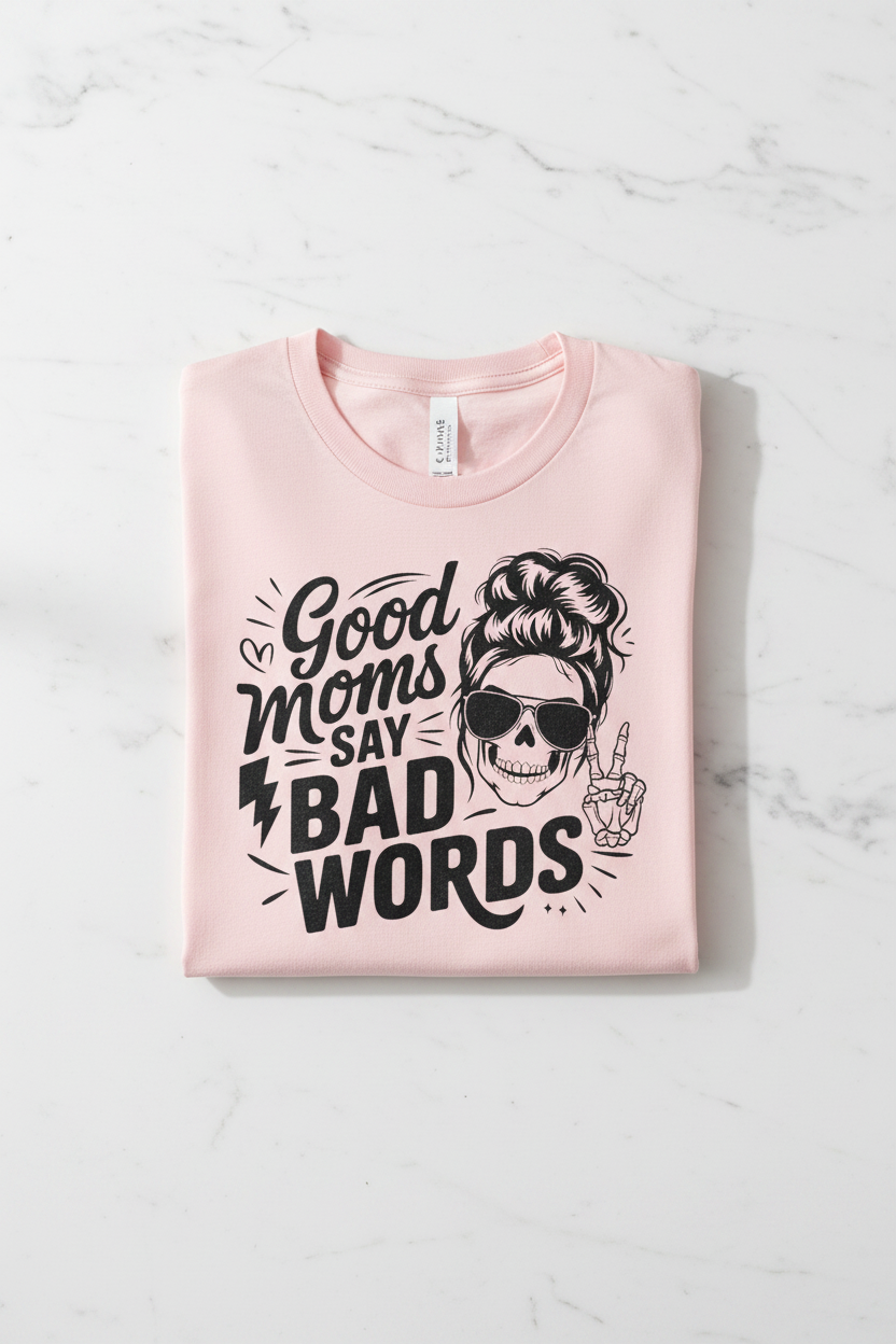 Good Moms Say Bad Words tee folded pink shirt flat lay