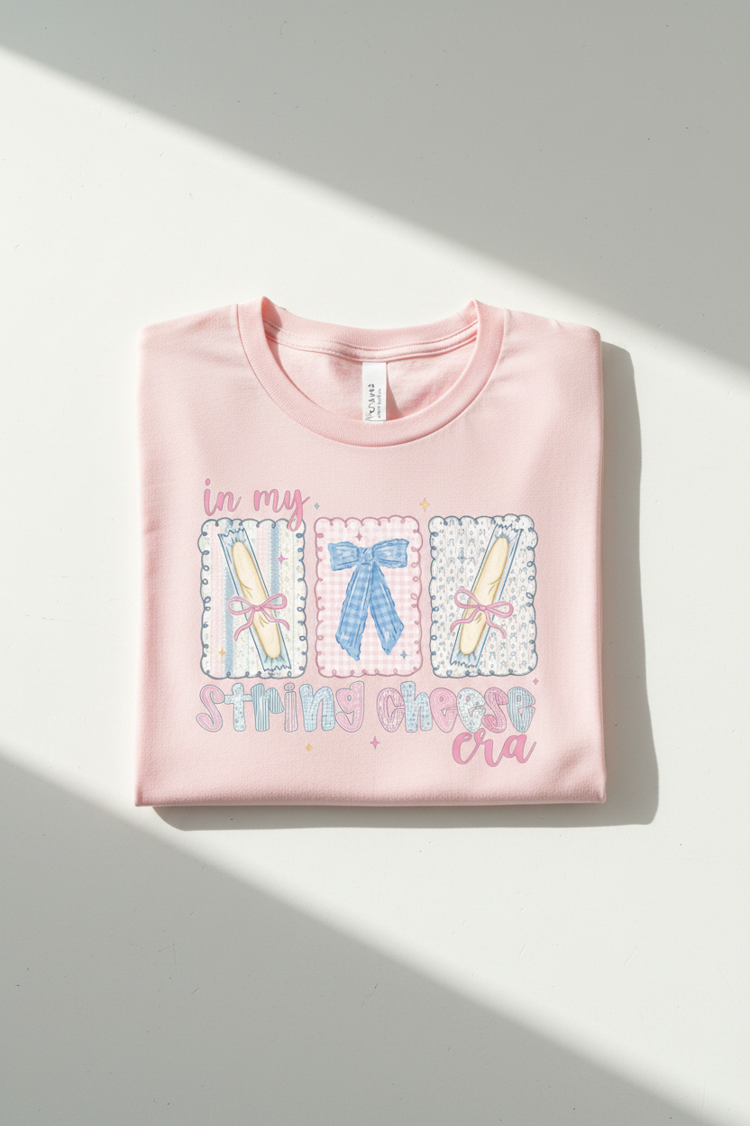 In My String Cheese Era tee folded pink shirt flat lay