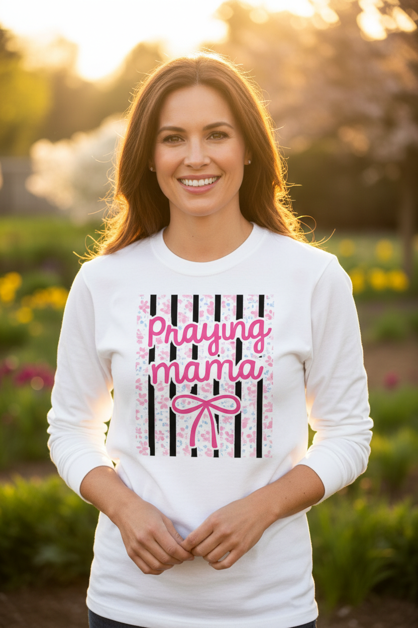 Woman wearing Praying Mama long sleeve tee lifestyle shot